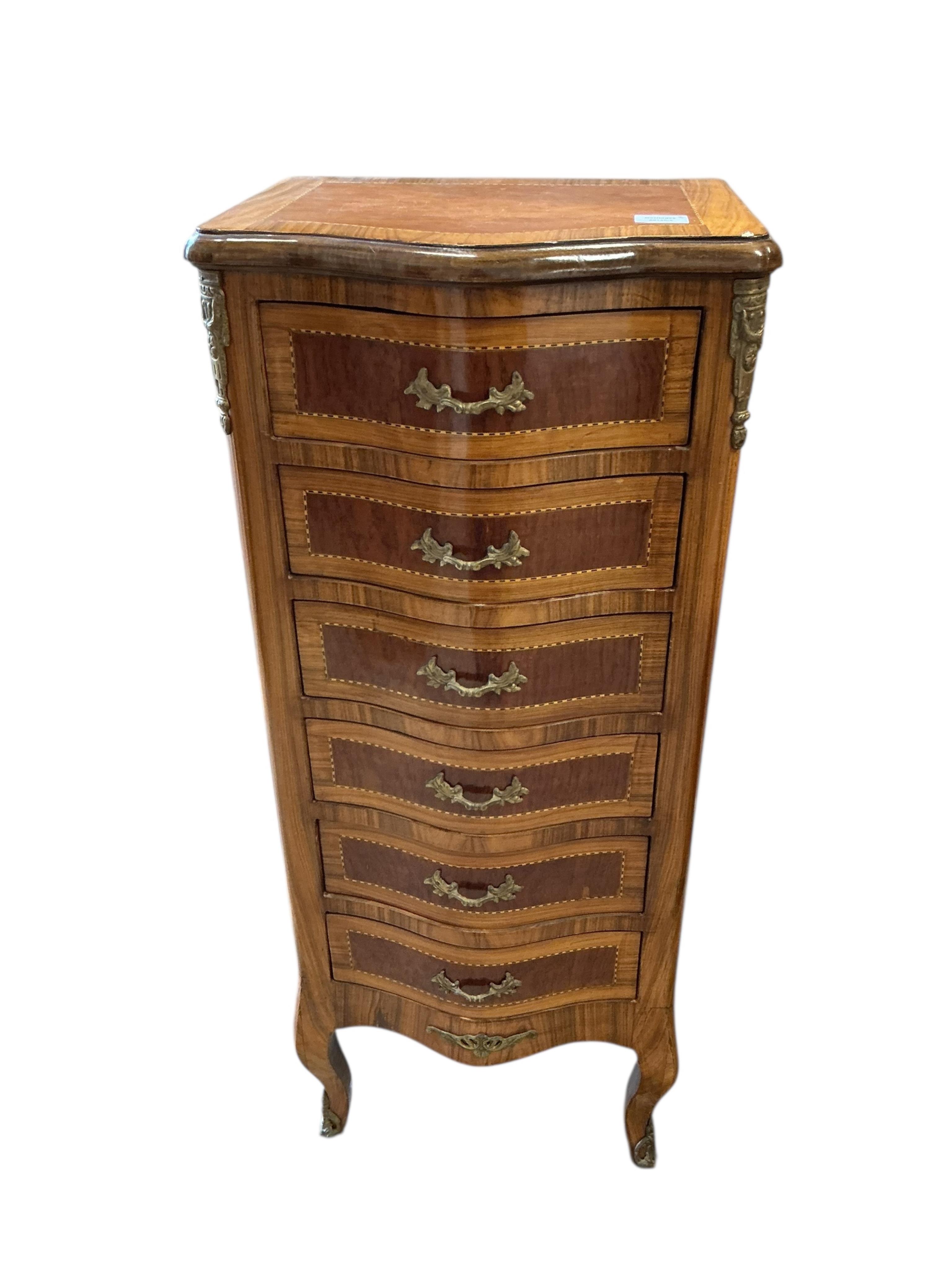 A pair of reproduction gilt metal mounted kingwood banded serpentine narrow seven drawer chests, width 45cm, depth 35cm, height 108cm